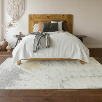 5' X 8' Silver Gold And Ivory Abstract Washable Area Rug With UV Protection