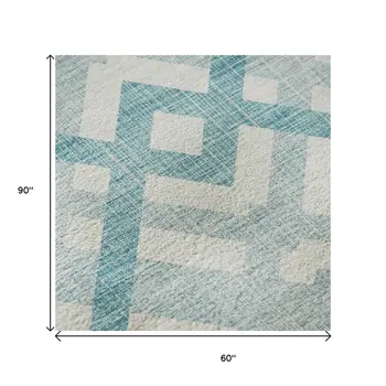 5' X 8' Teal And Ivory Geometric Washable Area Rug With UV Protection