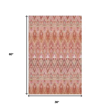 3' X 5' Pink Orange And Mint Green Southwestern Washable Area Rug With UV Protection