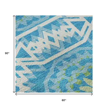 5' X 8' Blue Ivory And Olive Green Geometric Washable Area Rug With UV Protection