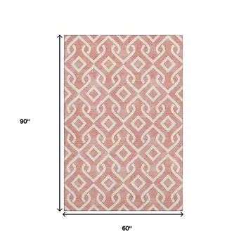 5' X 8' Salmon And Ivory Geometric Washable Area Rug With UV Protection
