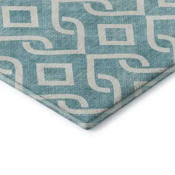 9' X 12' Teal And Ivory Geometric Washable Area Rug With UV Protection