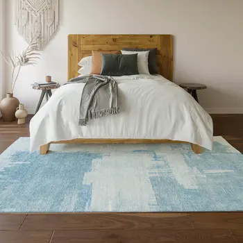 5' X 8' Sky Blue And Ivory Abstract Washable Area Rug With UV Protection