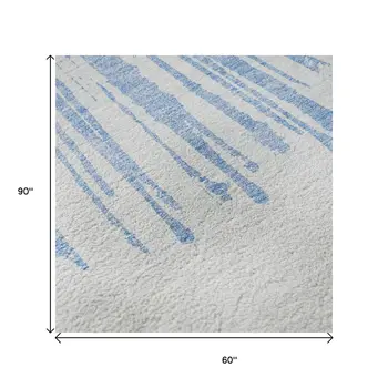 5' X 8' Denim Blue And Ivory Abstract Washable Area Rug With UV Protection