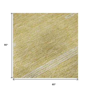 5' X 8' Gold And Ivory Abstract Washable Area Rug With UV Protection