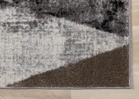 5' X 8' Cream And Brown Geometric Area Rug