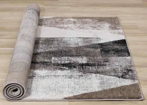 5' X 8' Cream And Brown Geometric Area Rug