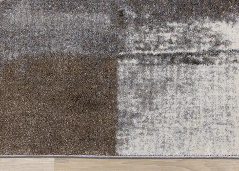5' X 8' Cream And Brown Geometric Area Rug
