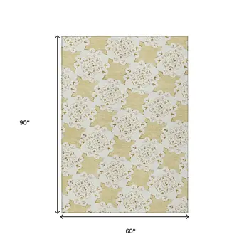 5' X 8' Wheat And Ivory Quatrefoil Washable Indoor Outdoor Area Rug