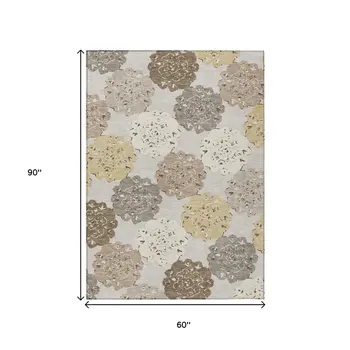 5' X 8' Pearl Ivory And Wheat Quatrefoil Washable Indoor Outdoor Area Rug