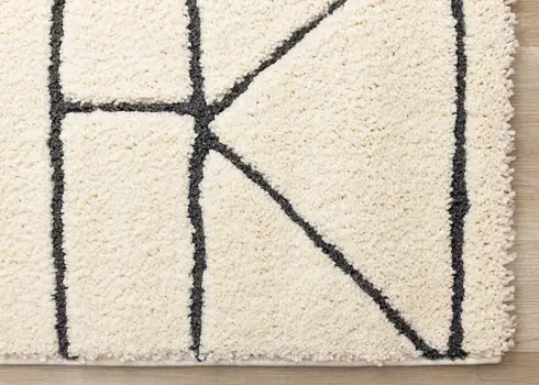 8' X 11' Cream And Black Geometric Area Rug