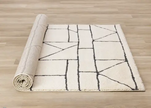 8' X 11' Cream And Black Geometric Area Rug