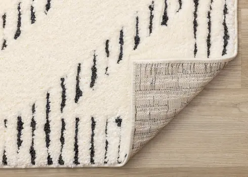 5' X 8' Cream And Black Geometric Area Rug