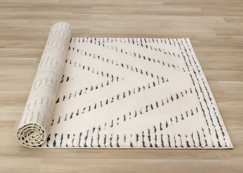 5' X 8' Cream And Black Geometric Area Rug