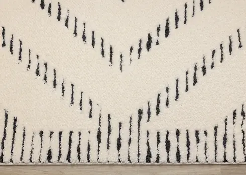 5' X 8' Cream And Black Geometric Area Rug