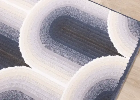 5' X 8' Cream And Blue Geometric Area Rug