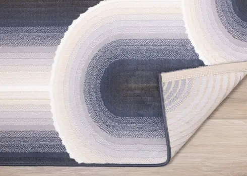 5' X 8' Cream And Blue Geometric Area Rug