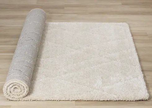 5' X 8' Cream And Beige Geometric Area Rug