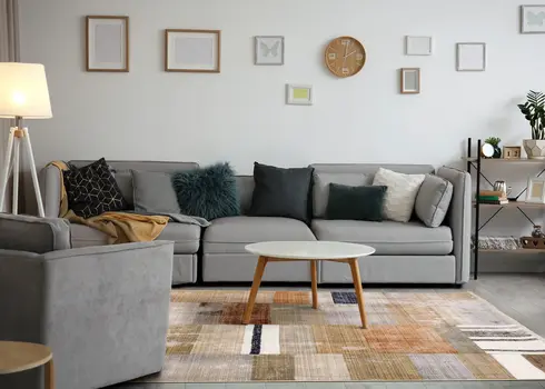 5' X 8' Beige And Orange Geometric Area Rug
