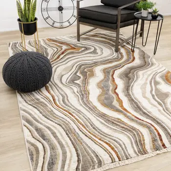 7' X 10' Cream And Beige Abstract Area Rug