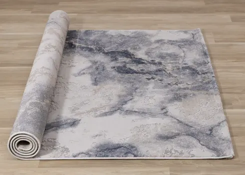 7' X 10' Blue And Cream Abstract Area Rug