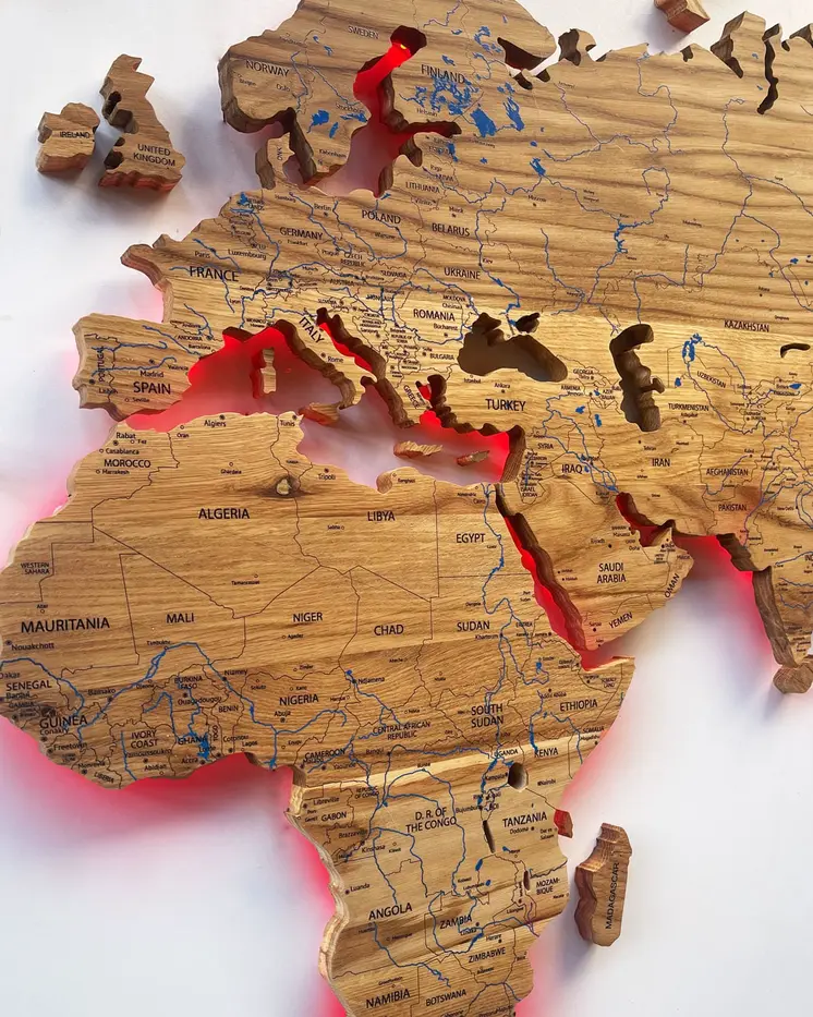 World map illuminated from solid oak