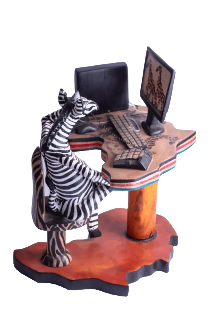 Wooden Zebra Sitting at Computer