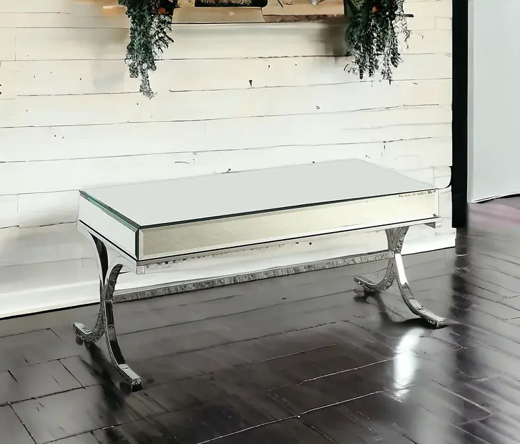42" Clear and Silver Mirrored Glass And Iron Sled Coffee Table