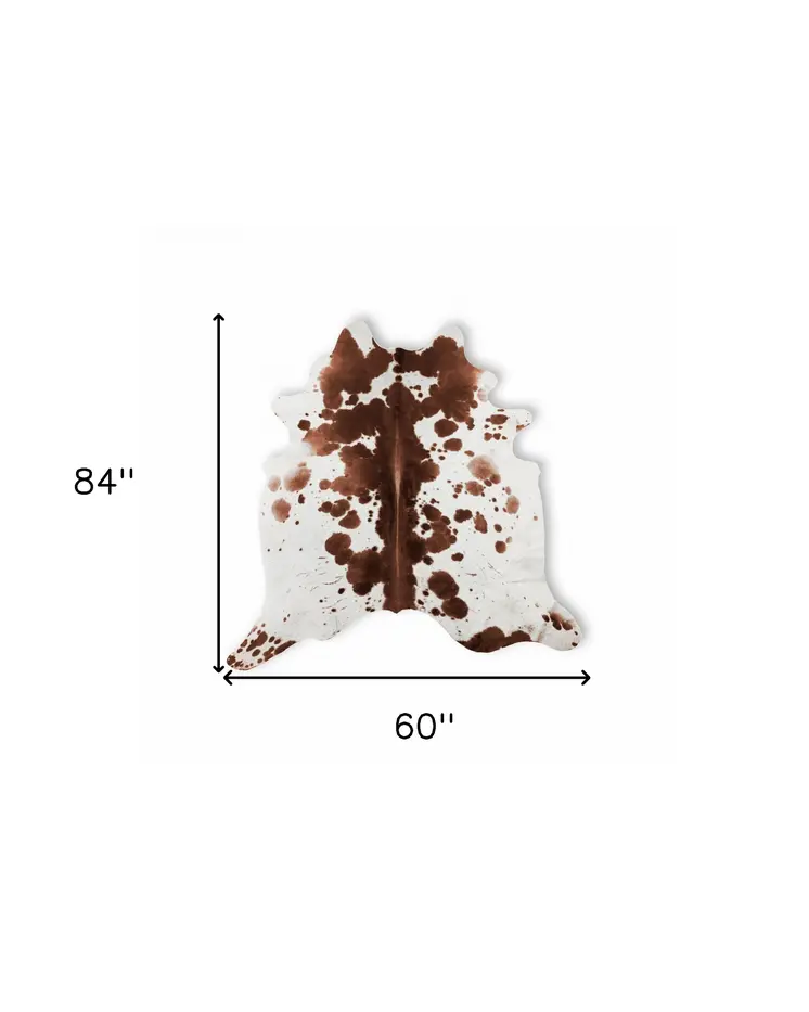 5' X 7' Brown And White Cowhide Cowhide Print Area Rug