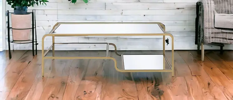 52" Clear and Gold Mirrored Glass And Iron Coffee Table With Shelf