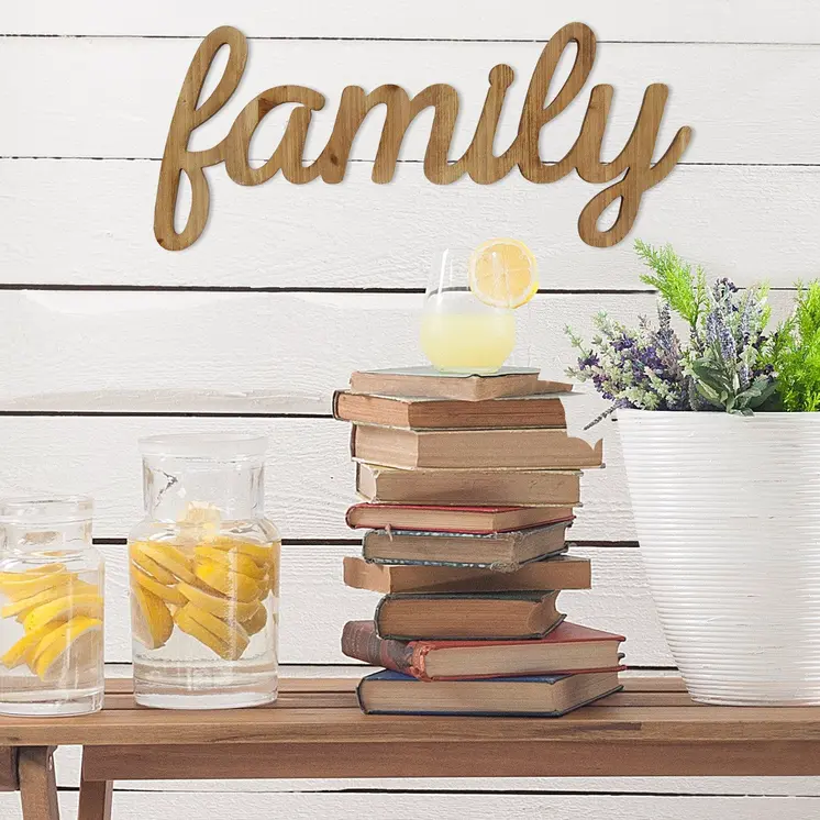 10" X 23" Natural Carved Wood Family Text Wall Decor