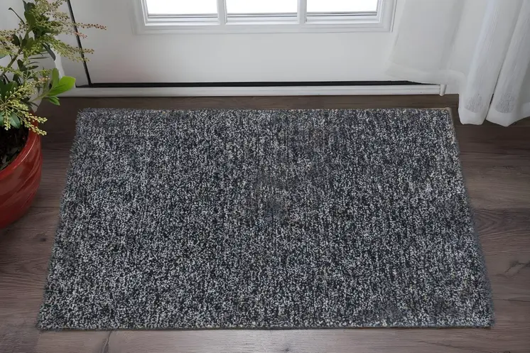 2' X 4' Black And White Shag Hand Woven Area Rug