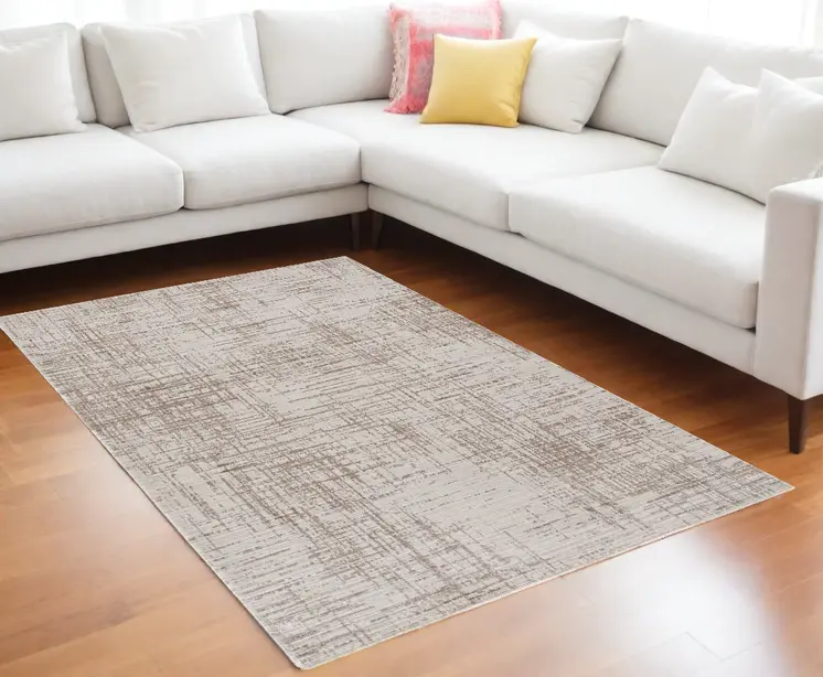 8' X 11' Beige And Tan Abstract Distressed Area Rug