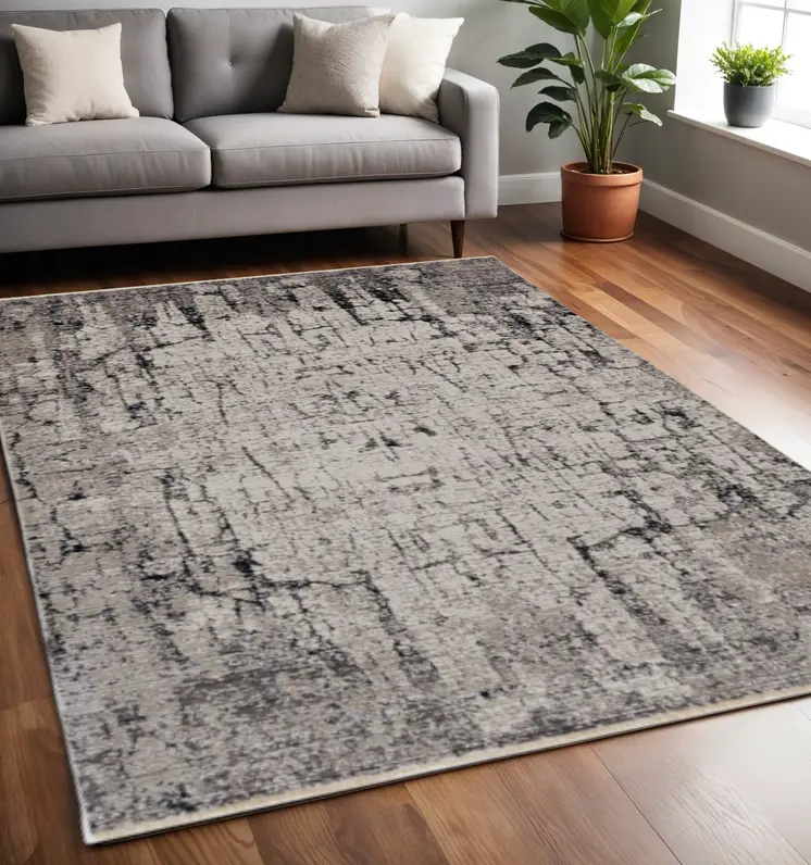 5' X 8' Ivory And Gray Abstract Distressed Area Rug