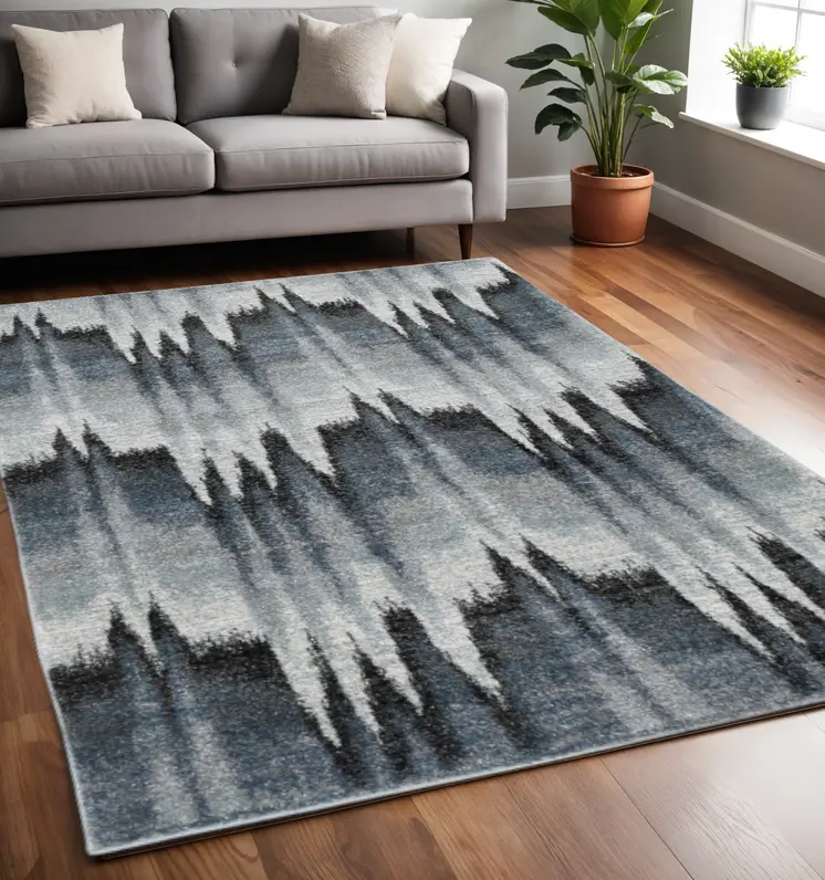 5' X 8' Blue And Ivory Geometric Area Rug