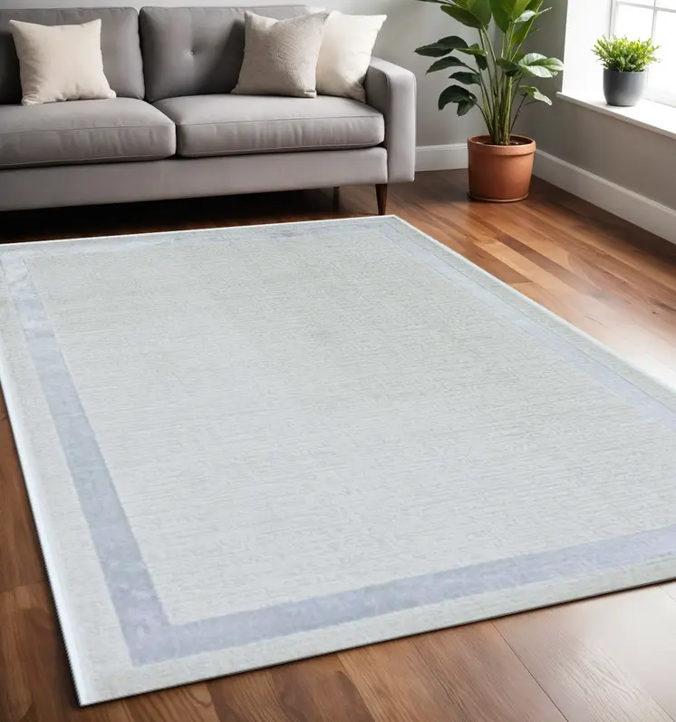 5' X 8' Ivory And Silver Geometric Area Rug