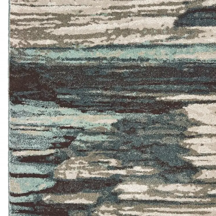 7' X 10' Ivory Blue And Gray Abstract Area Rug
