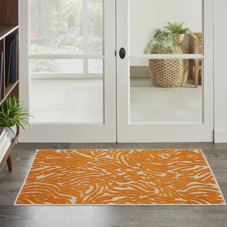 3' X 4' Orange And Ivory Abstract Indoor Outdoor Area Rug