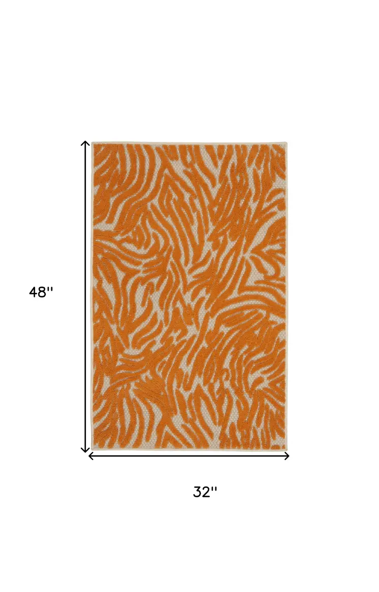 3' X 4' Orange And Ivory Abstract Indoor Outdoor Area Rug
