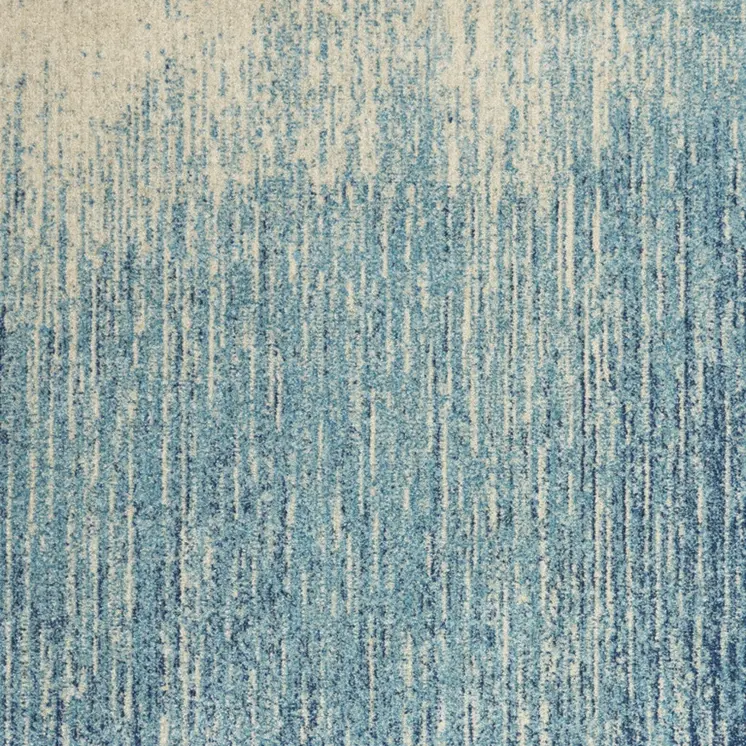 5' X 7' Blue And Ivory Abstract Area Rug