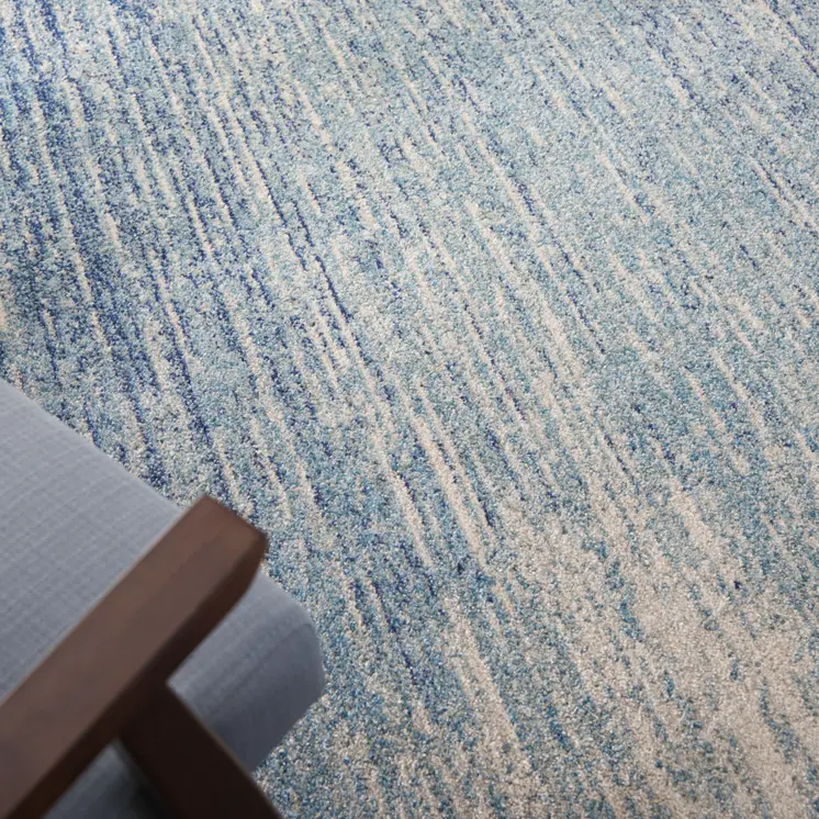 5' X 7' Blue And Ivory Abstract Area Rug