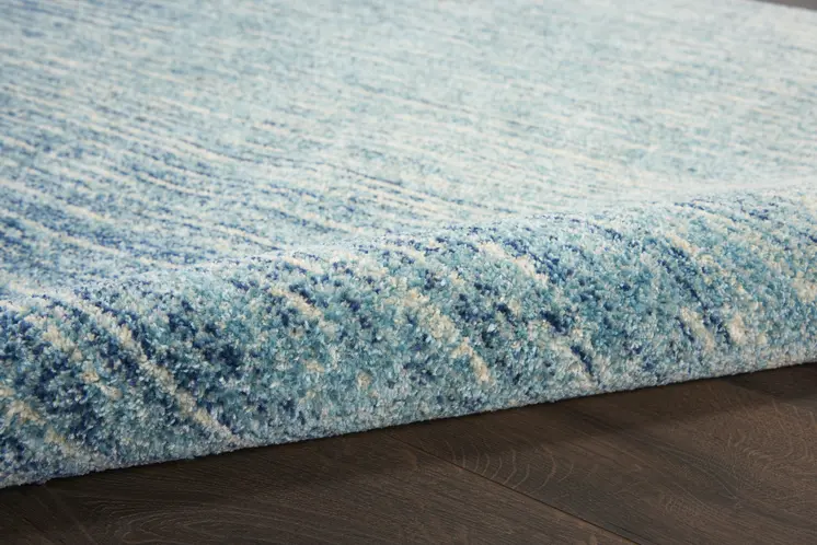 7' X 10' Blue And Ivory Abstract Area Rug