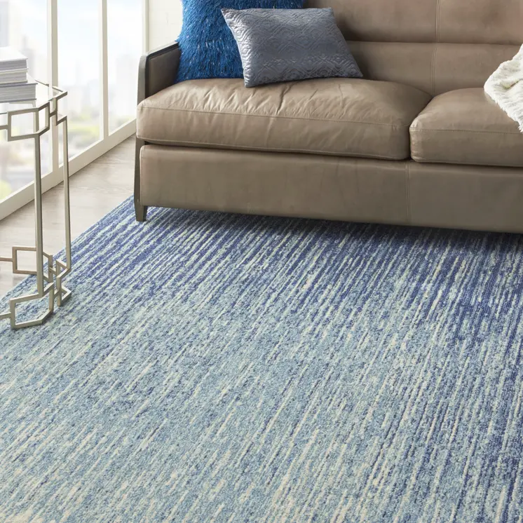 7' X 10' Blue And Ivory Abstract Area Rug