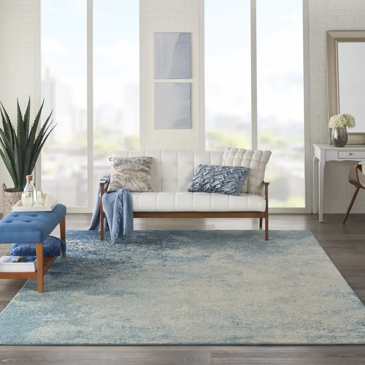 7' X 10' Blue And Ivory Abstract Area Rug