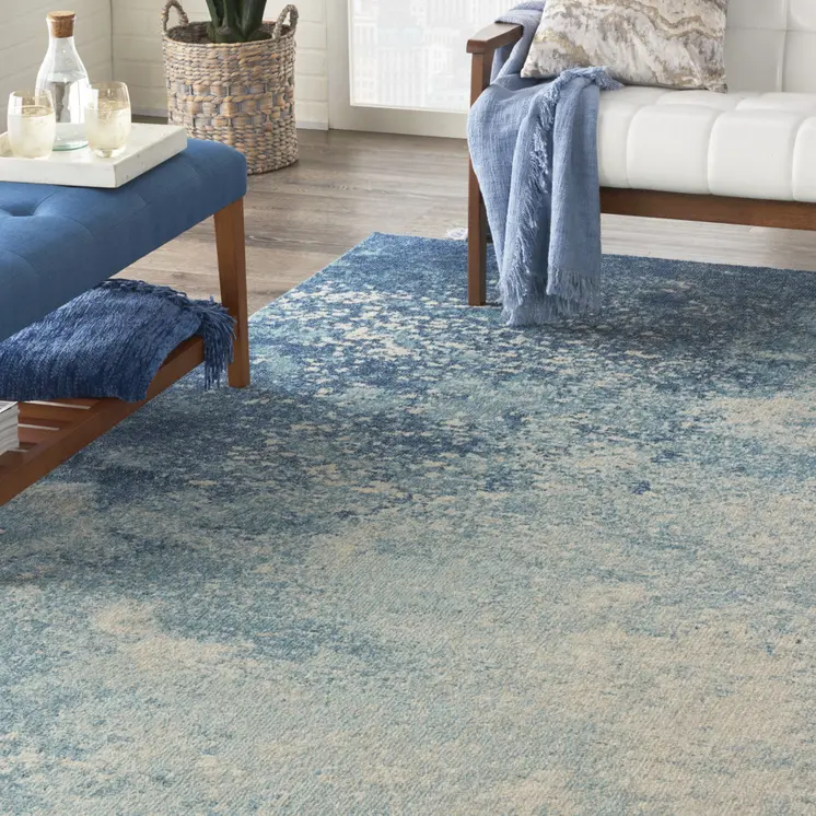 7' X 10' Blue And Ivory Abstract Area Rug