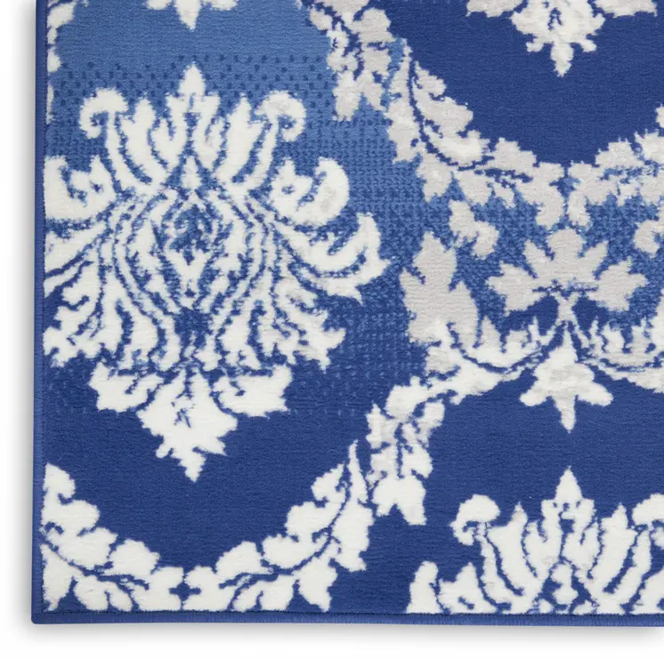5' X 7' Blue And Ivory Damask Distressed Area Rug