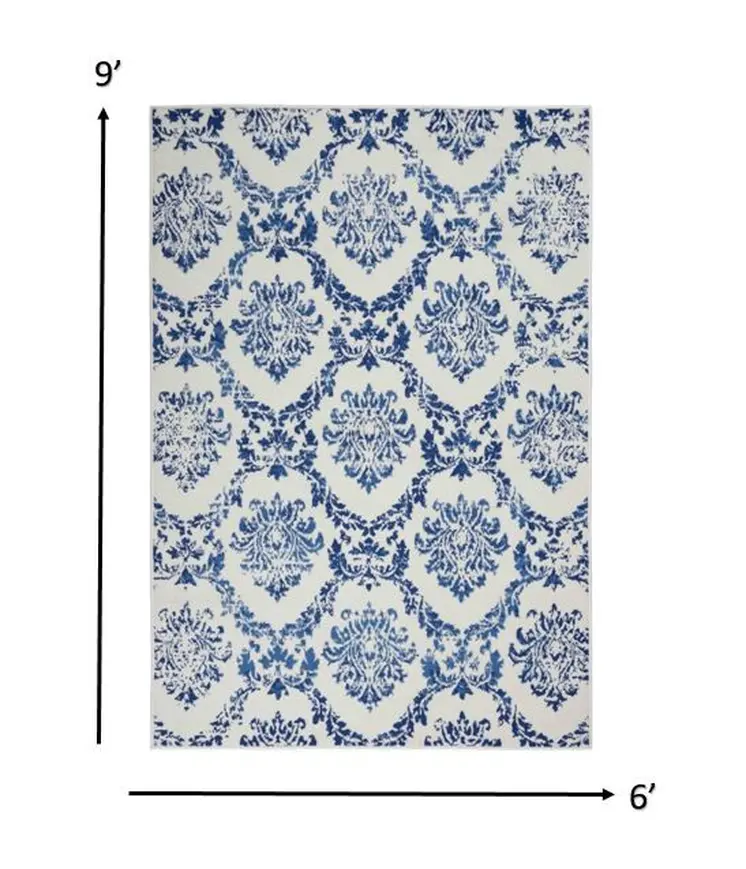 6' X 9' Ivory And Blue Damask Distressed Area Rug