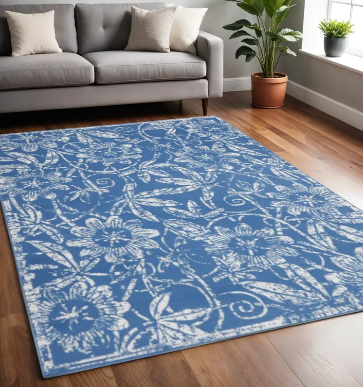 5' X 7' Blue And Ivory Floral Vines Distressed Area Rug