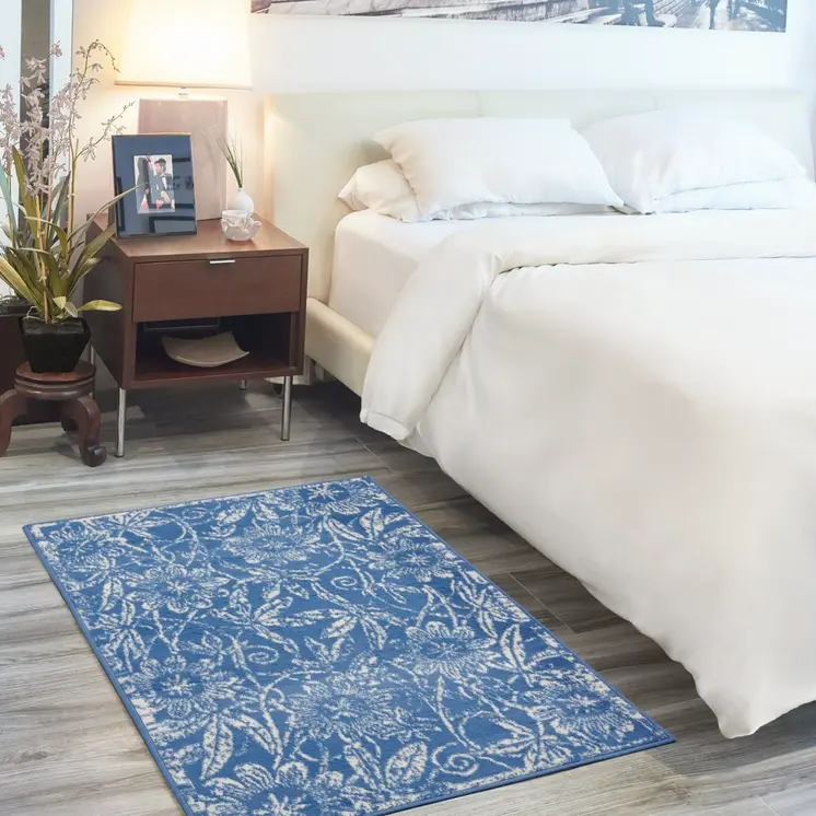 6' X 9' Blue And Ivory Floral Distressed Area Rug