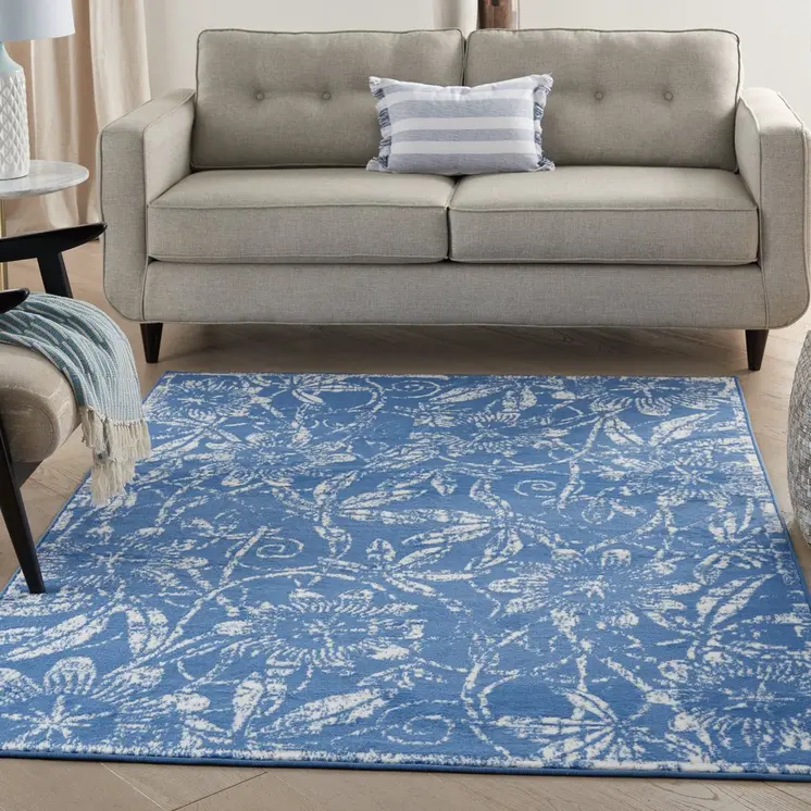 6' X 9' Blue And Ivory Floral Distressed Area Rug
